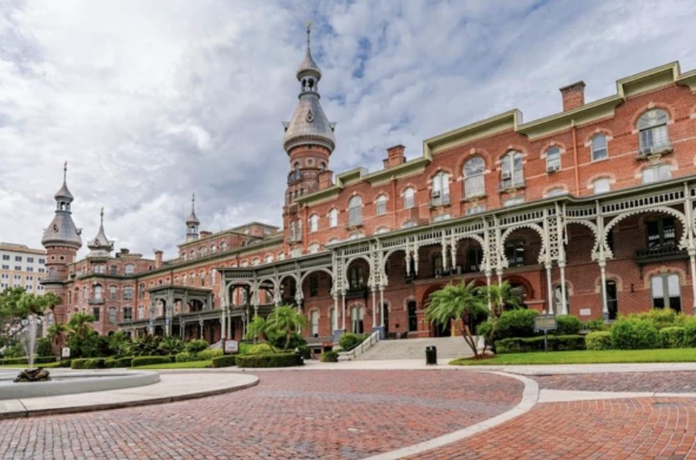 Copper air terminal with natural patina installed on historic building slate roof