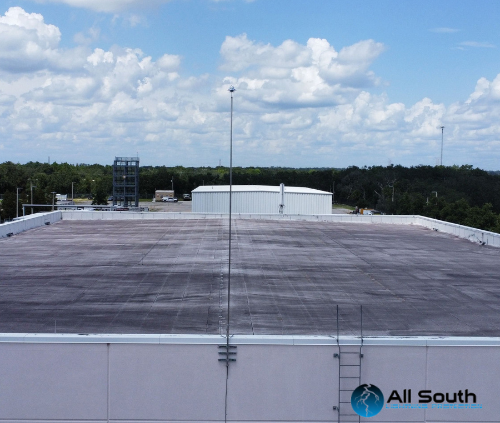 Lightning protection grounding electrode and bonding connection being tested during UL 96A recertification inspection at a Florida commercial facility