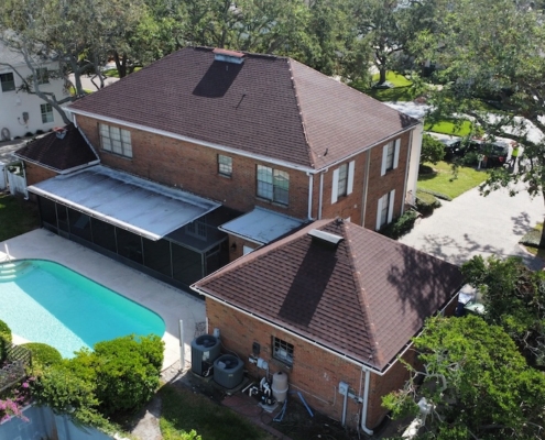 Residential lightning protection system with air terminals and down conductors installed on a Tampa home