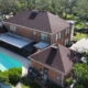 Residential lightning protection system with air terminals and down conductors installed on a Tampa home